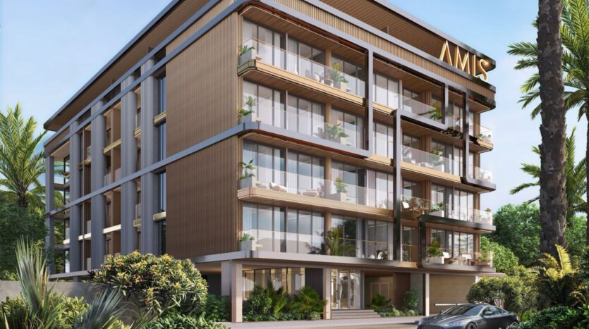 A modern four-story building called Derby Heights features large glass balconies and a wood-paneled exterior. A car is parked in front of the building, and tropical plants surround the property. On the roof of the building is a sign that reads "AMIS."