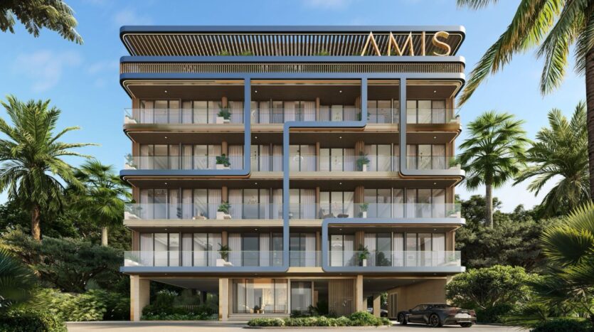 Derby Heights, a modern four-story apartment building, features large glass balconies and decorative metal accents on the facade. Surrounded by palm trees and with a car parked in front, the roof displays the letters "NMS" in bold.