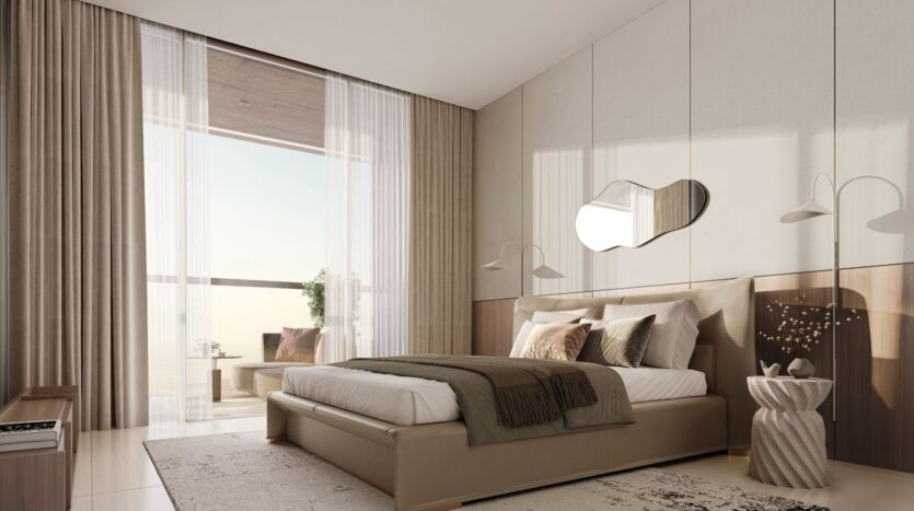 A modern bedroom in Derby Heights featuring a king-size bed, neutral-toned bedding, an abstract mirror, and matching side tables. A floor-to-ceiling window with sheer curtains lets in natural light, revealing a balcony with a view.
