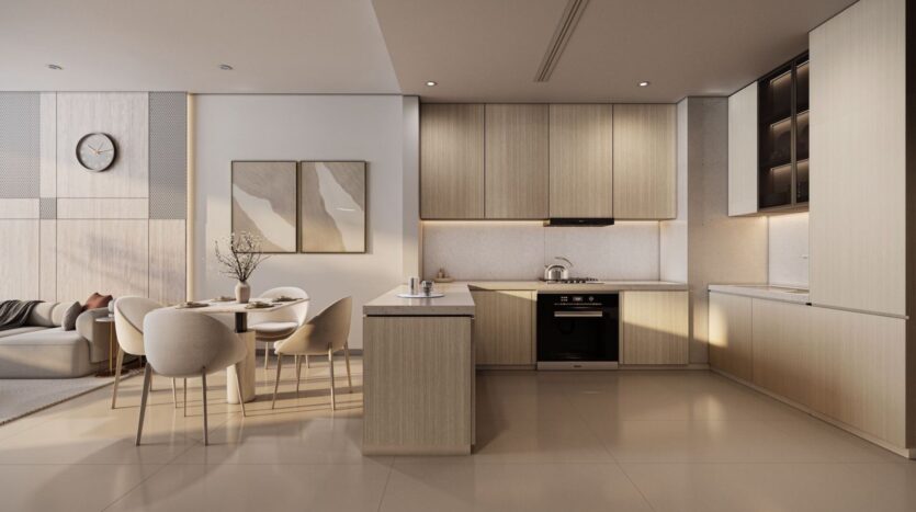 A modern kitchen and dining room in Derby Heights featuring light wood cabinets, a built-in oven, minimalist decor, a round table for four, neutral tones, and a cozy living area with a sofa visible in the background.