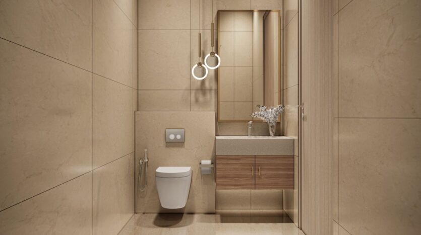 Modern bathroom in Derby Heights featuring beige marble walls and floors, a wall-mounted toilet and bidet, a floating wooden vanity with a sink, a large mirror, two pendant lights, and a vase of flowers on the countertop.