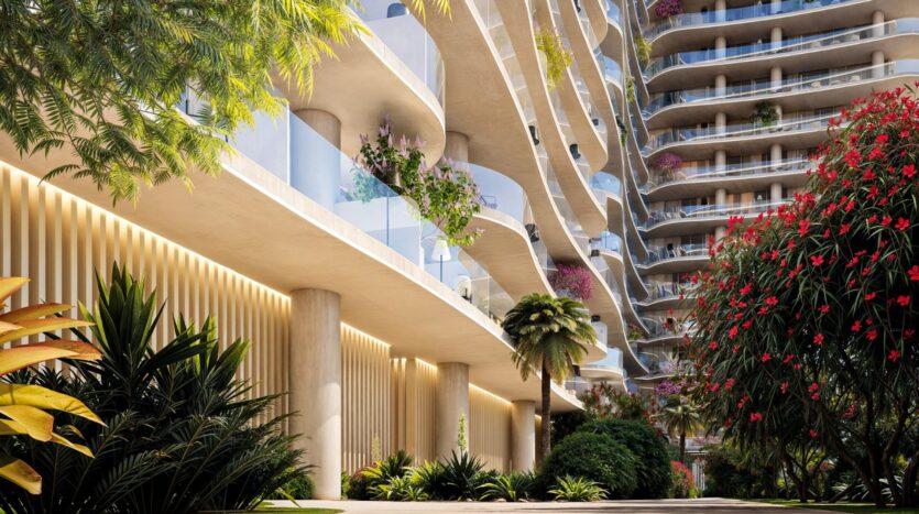 L'immeuble d'appartements contemporain, The Wow Tower, est doté de balcons incurvés et de garde-corps en verre. Entourés d'une végétation luxuriante et de fleurs éclatantes, les espaces extérieurs accueillants sont baignés par la lumière du soleil, ce qui crée une atmosphère vraiment étonnante.