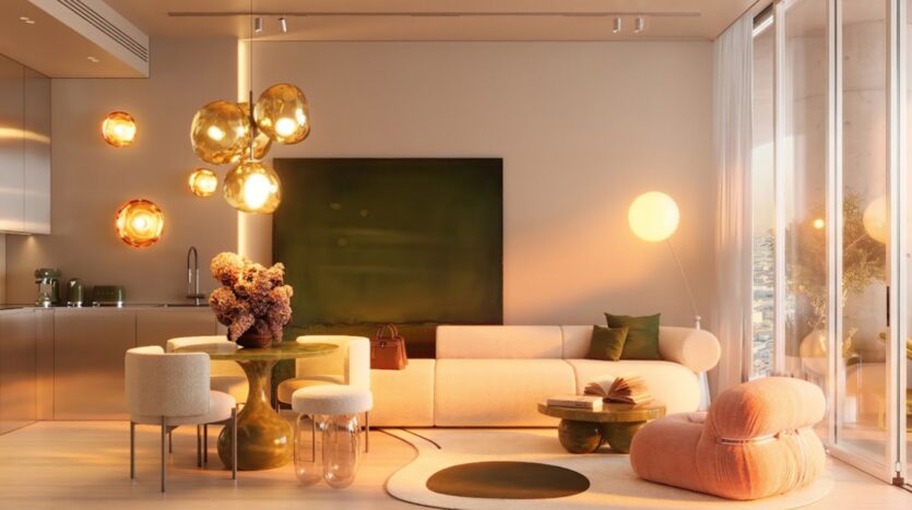 Un salon moderne dans la tour Wow avec un éclairage chaleureux, un canapé beige, une chaise ronde rose, des accents verts, un centre de table floral sur la table à manger, et de grandes fenêtres laissant entrer la lumière naturelle. Un décor contemporain et une atmosphère douce et confortable.