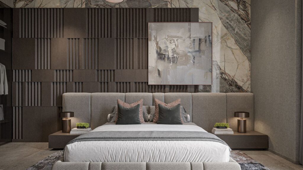 Une chambre à coucher moderne comprenant un grand lit avec des oreillers Oxford Cove by Iman, une tête de lit douce et une œuvre d'art abstraite sur un mur texturé. Chaque table de nuit est agrémentée de lampes et de petites plantes pour une touche de verdure.