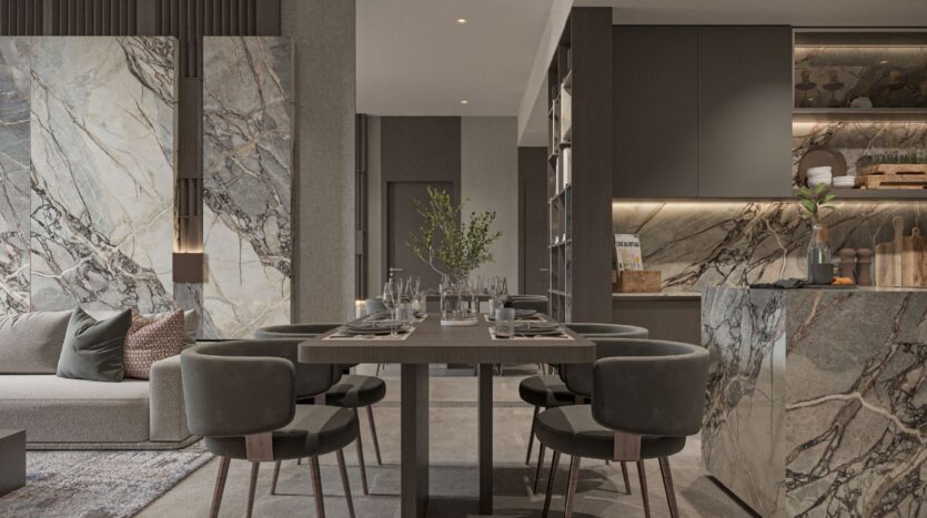 Salle à manger moderne avec une table pour six personnes, entourée de chaises rembourrées. L'espace sophistiqué présente des surfaces en marbre et un éclairage élégant, faisant écho au style raffiné d'Oxford Cove by Iman dans une cuisine minimaliste aux tons neutres.