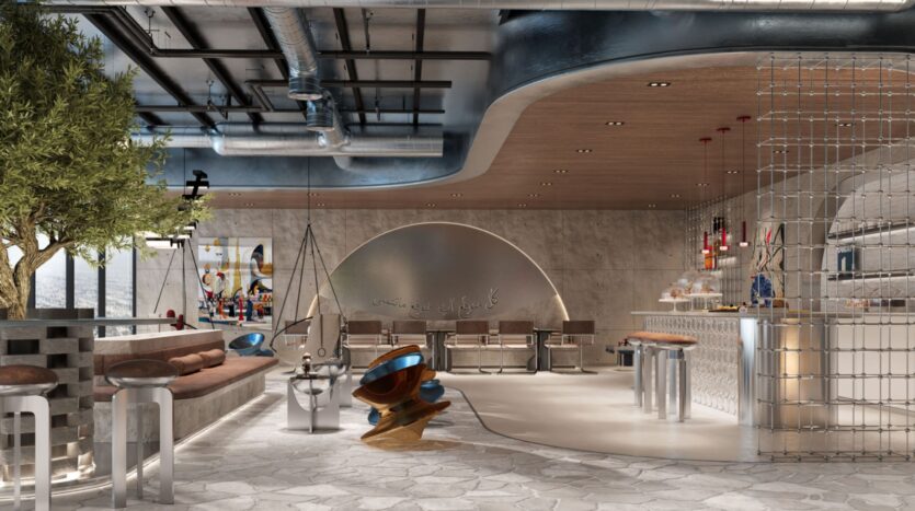 Intérieur de café moderne au Raw District par Imtiaz, avec un design industriel et contemporain, des conduits apparents, un plafond en bois courbé unique, un sol en pierre, des meubles élégants, un olivier et des sièges ouverts avec des textures et des matériaux mélangés.