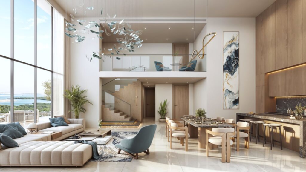 Le salon et la salle à manger modernes et spacieux des résidences Rotana sont dotés de grandes fenêtres, d'un mobilier contemporain, de sols en marbre, d'un escalier flottant et de luminaires artistiques. À l'extérieur, les vues sur la verdure et l'eau sont époustouflantes.