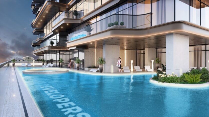 L'immeuble d'appartements de luxe moderne Tivanno by AYS dispose de balcons donnant sur une élégante piscine à débordement, des chaises longues et une végétation luxuriante. Les gens se détendent au bord de la piscine sous un éclairage crépusculaire doux, créant une atmosphère élégante et tranquille.