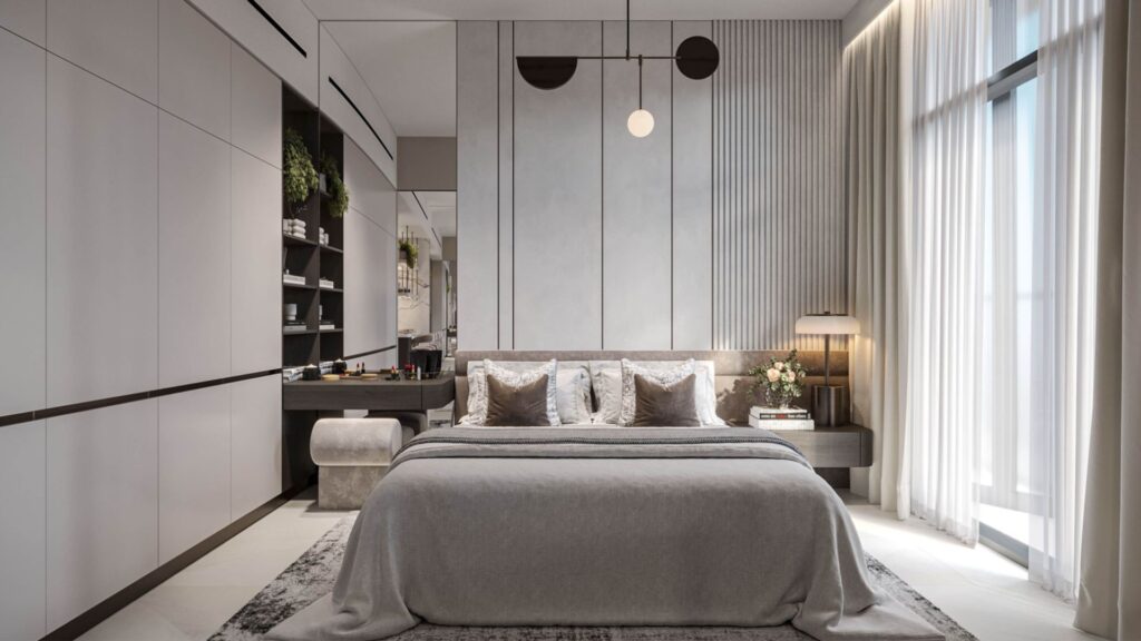 Chambre à coucher moderne et minimaliste avec un grand lit, des tons gris neutres, de hautes fenêtres avec des rideaux transparents, des étagères encastrées, des plantes décoratives et des luminaires Tresora by Wadan au-dessus de la tête de lit.