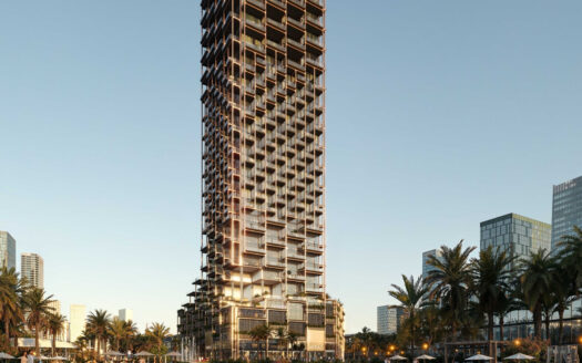 Un grand gratte-ciel moderne à la façade irrégulière et quadrillée se dresse au milieu des palmiers et d'autres gratte-ciel au coucher du soleil, alors que les lumières commencent à éclairer l'un des quartiers de Dubaï prisés par les investisseurs français dans l'immobilier à Dubaï.