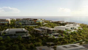 Les villas et immeubles modernes et luxueux de Modon Properties sont entourés d'une végétation luxuriante sur une colline surplombant l'océan. L'architecture se caractérise par des lignes épurées et de grandes fenêtres - découvrez tout savoir sur Modon Properties et ses conceptions harmonieuses.