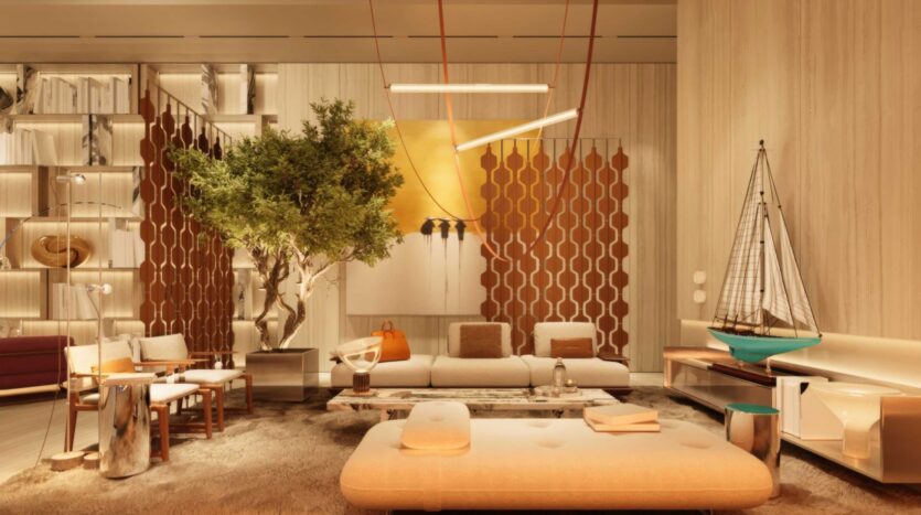 Un salon moderne à la Villa Del Garda avec un éclairage chaleureux, comprenant un arbre, des canapés beiges, un tapis à poils longs, des œuvres d'art murales abstraites, des cloisons géométriques en bois, des bibliothèques et une grande maquette décorative de voilier.