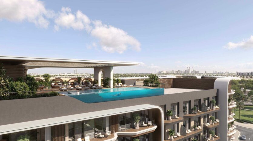 Une piscine à débordement sur le toit, agrémentée de transats et de cabines, au sommet d'un immeuble moderne, entourée de verdure, avec vue sur les toits de la ville sous un ciel bleu parsemé de nuages : découvrez le luxe à son apogée au Mirari Lagoon by Zoya.