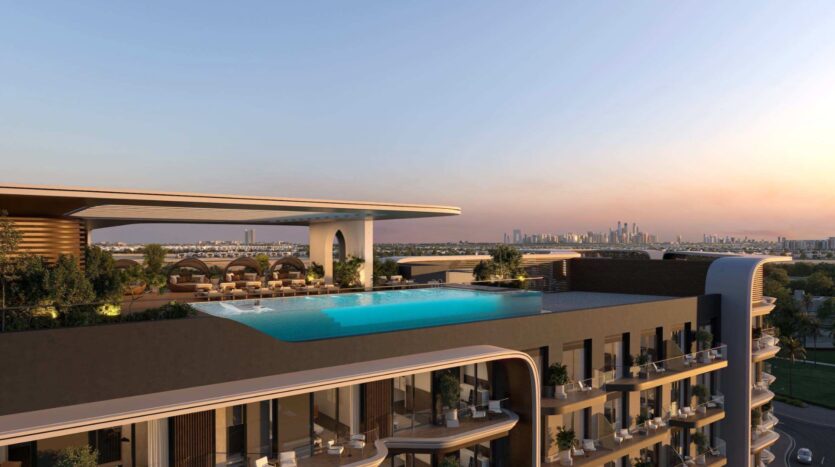 Piscine à débordement sur le toit d'un immeuble moderne au coucher du soleil, avec la silhouette de la ville et ses gratte-ciel visibles au loin. Au Mirari Lagoon by Zoya, les cabines au bord de la piscine et la végétation luxuriante apportent une touche de luxe.
